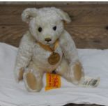 A Steiff Millenium mohair teddy bear with Danbury mint pendant.