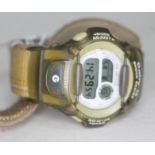 A Baby G digital wrist watch.