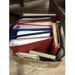 A box of stamps, albums and folders. 6 well stocked albums and various with few or no stamps