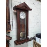 A mahogany Vienna clock with Gustav Becker movement.