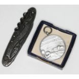 A water polo medal 1953 and a WWI Prisoner of War 'Souvenir De Captivite penknife'.