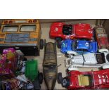 A box of assorted toys inc model vehicles.