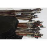 A large quantity of violin bows.