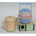 A group of three vintage plastic items comprising a musical 'radio', an Art Deco style biscuit jar