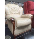 A cream leather wood show armchair