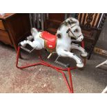 A vintage metal rocking horse