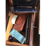 A vintage wooden box with contents + key.