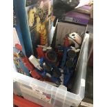 A crate of toys including Lego Harry Potter set, transformer style toys and Star wars meerkat toy