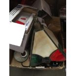 A box of misc electrical items to include a Tiffany style lamp shade and few ornaments.