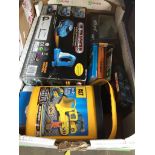 A box of toy cars including infra red controlled