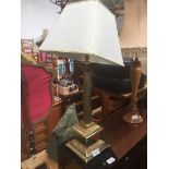 A brass column table lamp