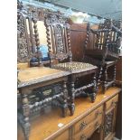 A set of four carved oak high back chairs