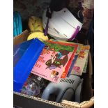 A box of items with helmet, Disney records, handheld vac etc