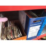 A quantity of vinyl LPs and a box of singles