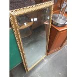 A gilt framed mirror