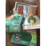 A box of gardening items.