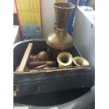 A plastic box containing few religious books, 3 brass vases and few ornaments.