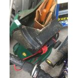 A Qualcast electric lawn mower and a pair of garden sheers