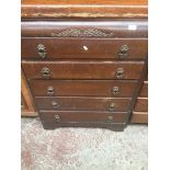 An oak chest of 5 drawers