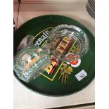 A Greenall's circular pub tray, beermats and ashtray