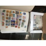 Stamp album and box of stamps