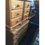 A pine chest of drawers and matching pair of bedside chests