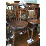 A pair of spindle back and elm seated chairs