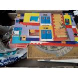 A box of vintage games including jigsaws