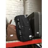 Two suitcases and a suede holdall