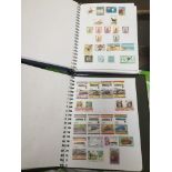 A collection of Commonwealth stamps in 2 albums.