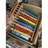 Box of childrens jigsaws and vintage wooden abacus