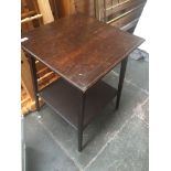 An Edwardian oak occasional table in the manner of Liberty & Co, height 69cm.