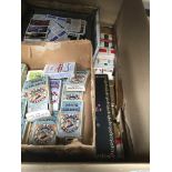 A box with a large collection of vintage and other cigarette cards