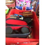 A crate of mixed items inc Salter scales, Laurel & Hardy figures, DVDs, flippers, etc