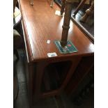 A teak drop leaf table