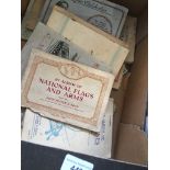 A box of cigarette card albums