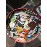 A tin of badges