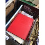 A crate of stamp albums