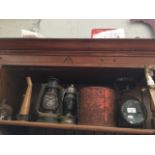 A collection of items inc a miners lamp, two hurricane lamps and a Canadian made fuel can.
