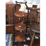 A mahogany folding cake stand