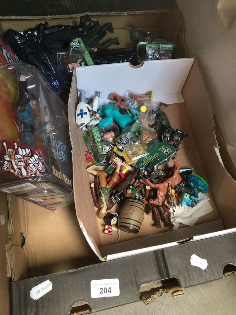 A box of figures including Star Wars, etc