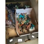 A box of figures including Star Wars, etc