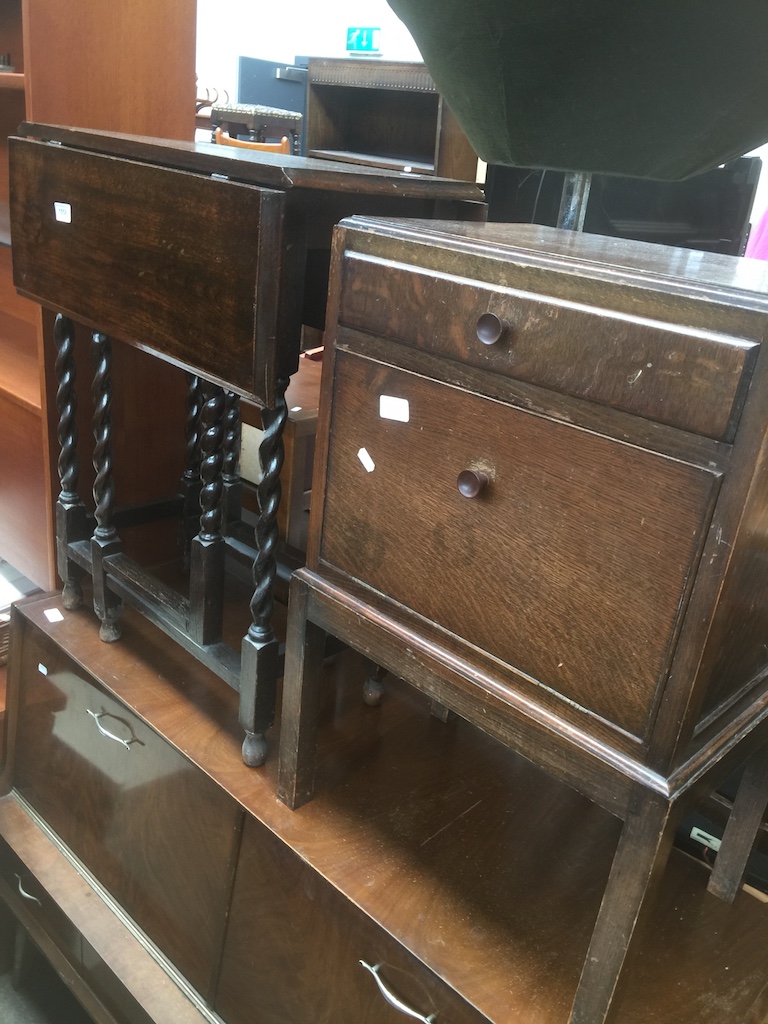 An oak drop leaf side table and an oak cupboard