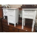 Three white bedside cabinets