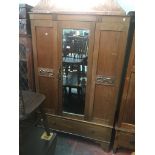 An oak mirror door wardrobe