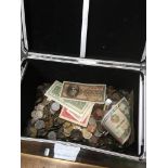 A box of world coins and banknotes