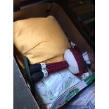 A box of bedding and a doll.