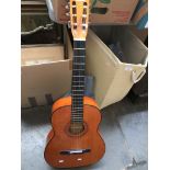 A Tatra Classic acoustic guitar with soft case.