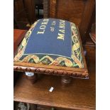 An upholstered foot stool