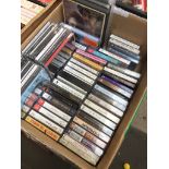 A box of CDs, music cassettes, etc